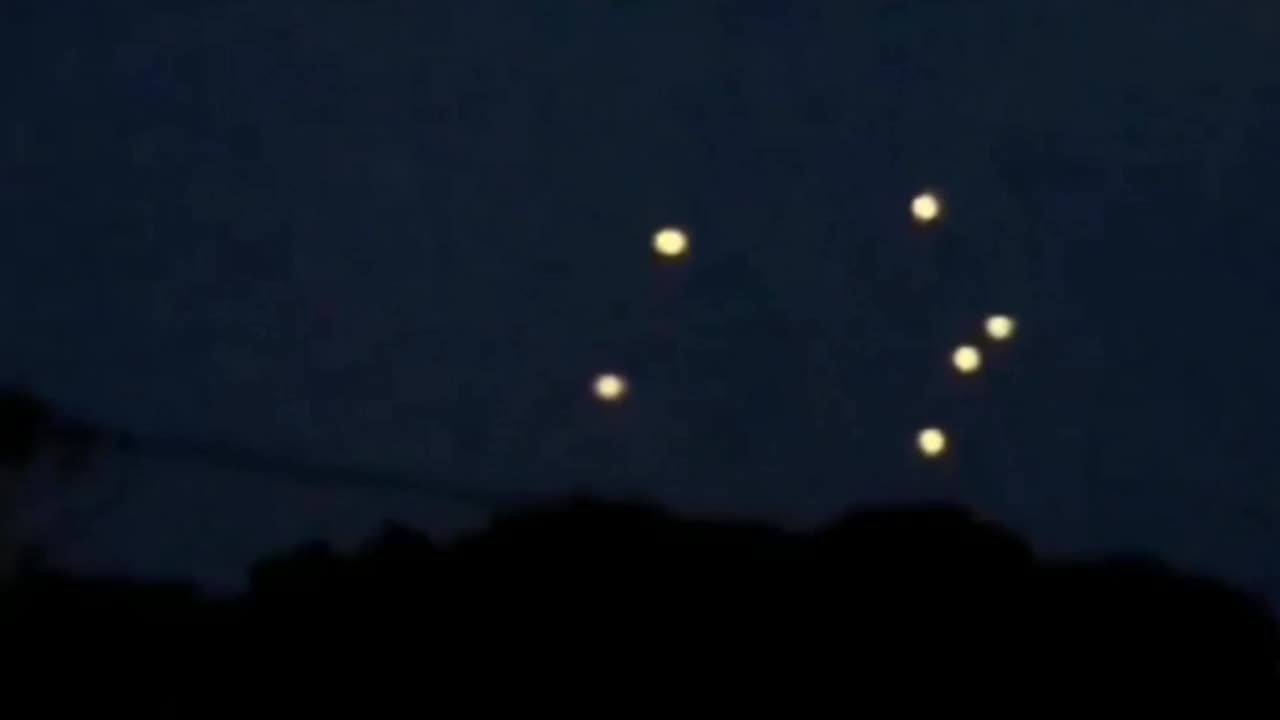Wisconsin USA people capture luminous object that formed into a small fleet of luminous objects UFO