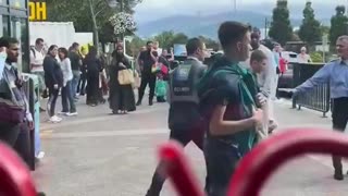 Indian security guard attacks a young Irish fella that was being subdued by his colleague.
