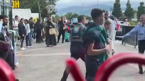 Indian security guard attacks a young Irish fella that was being subdued by his colleague.