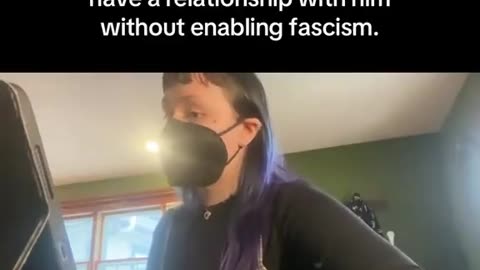 A woman with purple hair and a mask cuts off her grandfather because he's a Republican