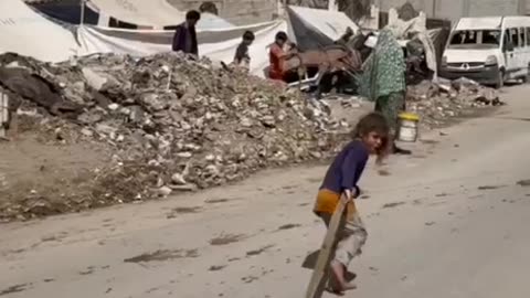 A Palestinian child struggles to obtain clean water in the Gaza Strip.