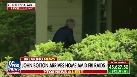 John Bolton arrives home following FBI raids to his office and home.