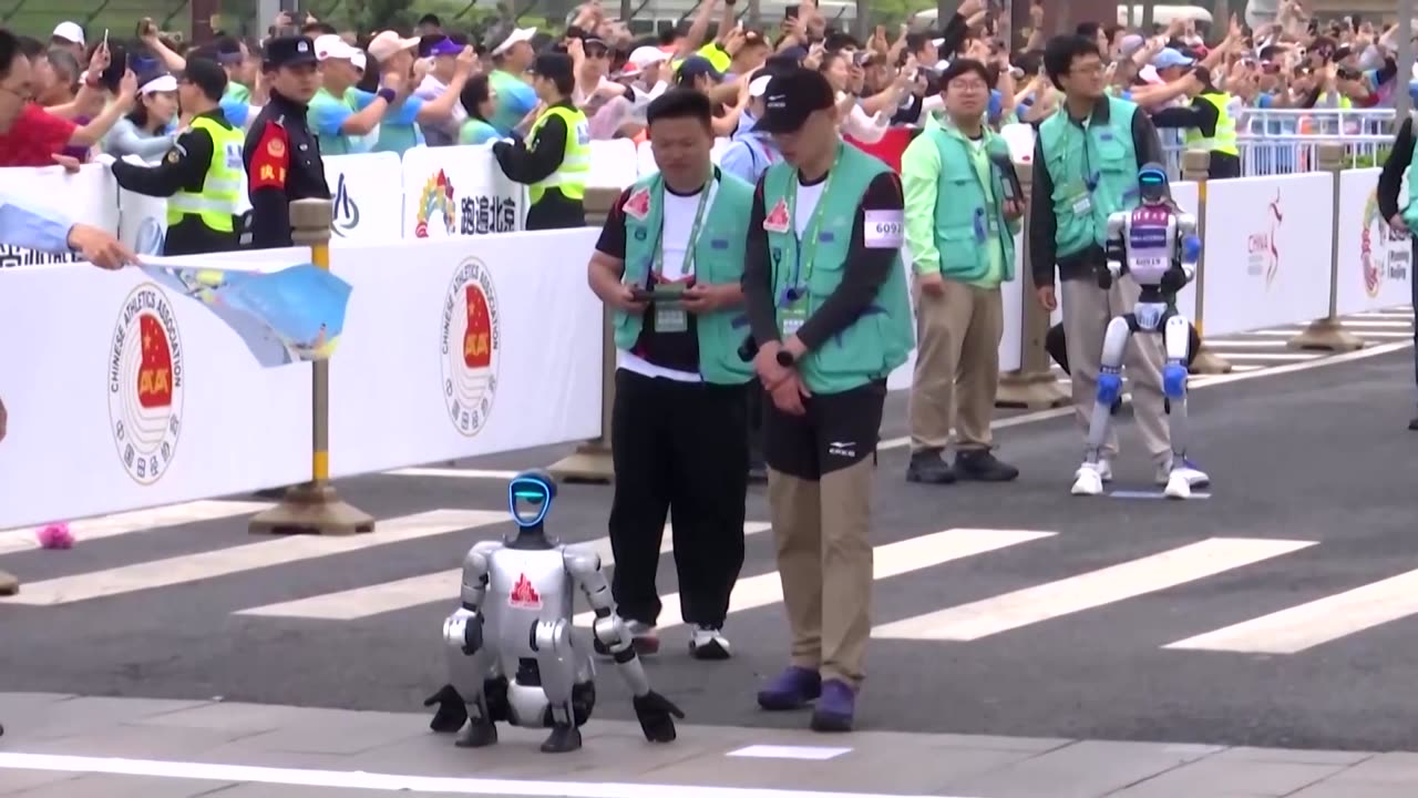 Humanoid robots race humans in a half-marathon in Beijing