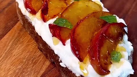 breakfast idea toast with cream cheese and plum and honey