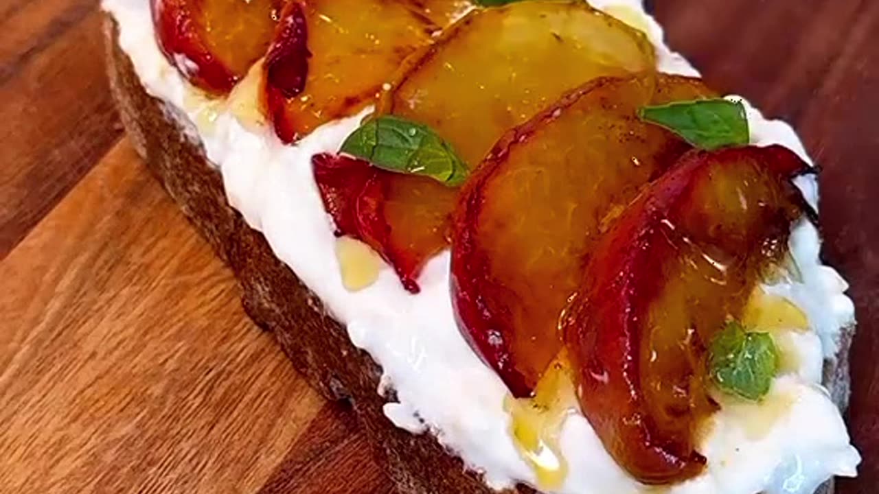 breakfast idea toast with cream cheese and plum and honey