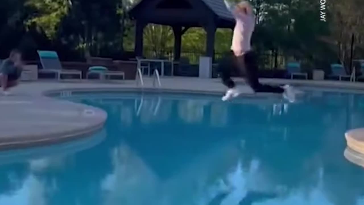 This guy attempts an ambitious pool jump and it did not go well...