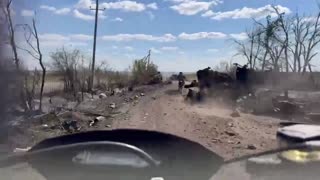 Russian Scooter Squad Moving Through Destroyed Vehicles Near Malynivka