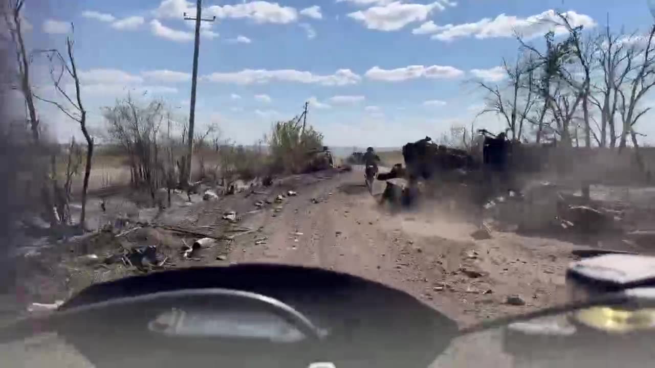 Russian Scooter Squad Moving Through Destroyed Vehicles Near Malynivka