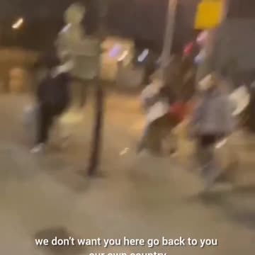 Truly unsettling scenes unfolding in Ireland lately. An Irish woman looks on in