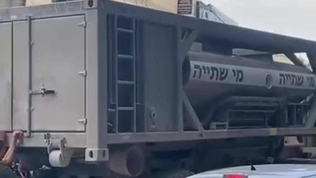 Young boys play with an occupation army military truck during its raid on Jenin