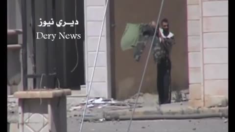 Syrian soldier gets sniped while retrieving his dried clothes ( Syria 2013 )