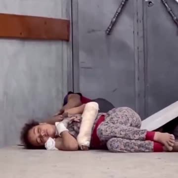 This wounded Palestinian girl lies on a hospital floor without a blanket