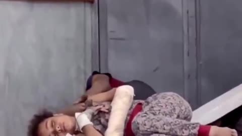 This wounded Palestinian girl lies on a hospital floor without a blanket