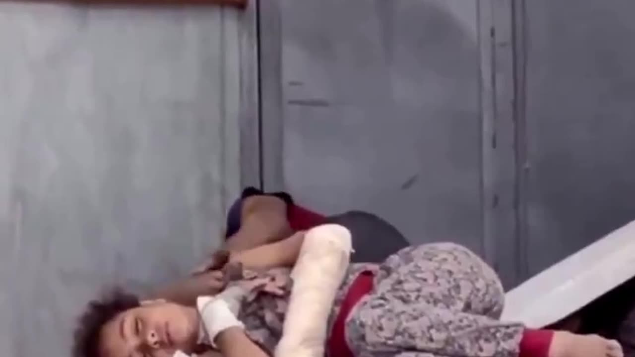 This wounded Palestinian girl lies on a hospital floor without a blanket