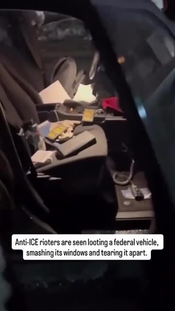 Breaking🚨Anti-ICE rioters are seen looting a federal vehicle, smashing its windows and tearing it apart