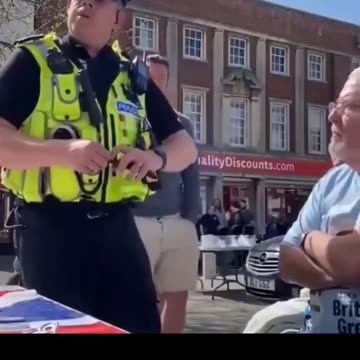 A British officer warns an elderly man that saying “Speak English” could be a hate crime.