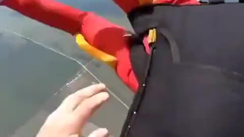 Skydiving Instructor MID AIR rescue of a skydiver that could not get her parachute to open.