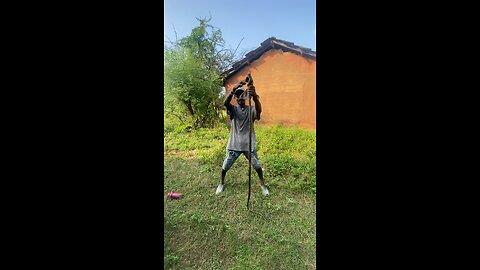 A man from a village has caught a snake