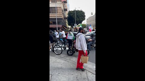 Huge crowd marching through downtown LA.