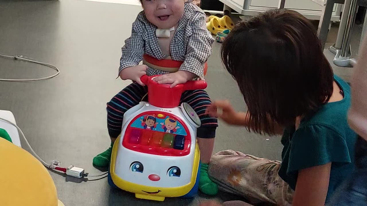 Theo Lim sliding on car with sisters