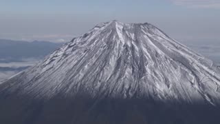 Japan's Mount Fuji gets first snow, 21 days later than usual
