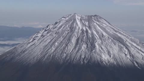 Japan's Mount Fuji gets first snow, 21 days later than usual