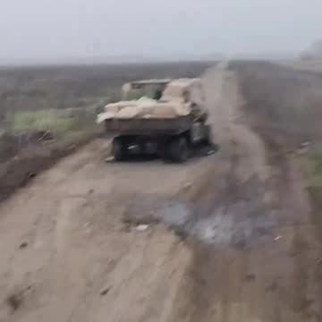 Russian Transport Running a Gauntlet of Destroyed Vehicles, Craters, and Attack Drones