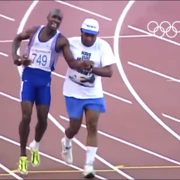 Derek Redmond’s dad helps him during the Olympics after he tore his hamstring