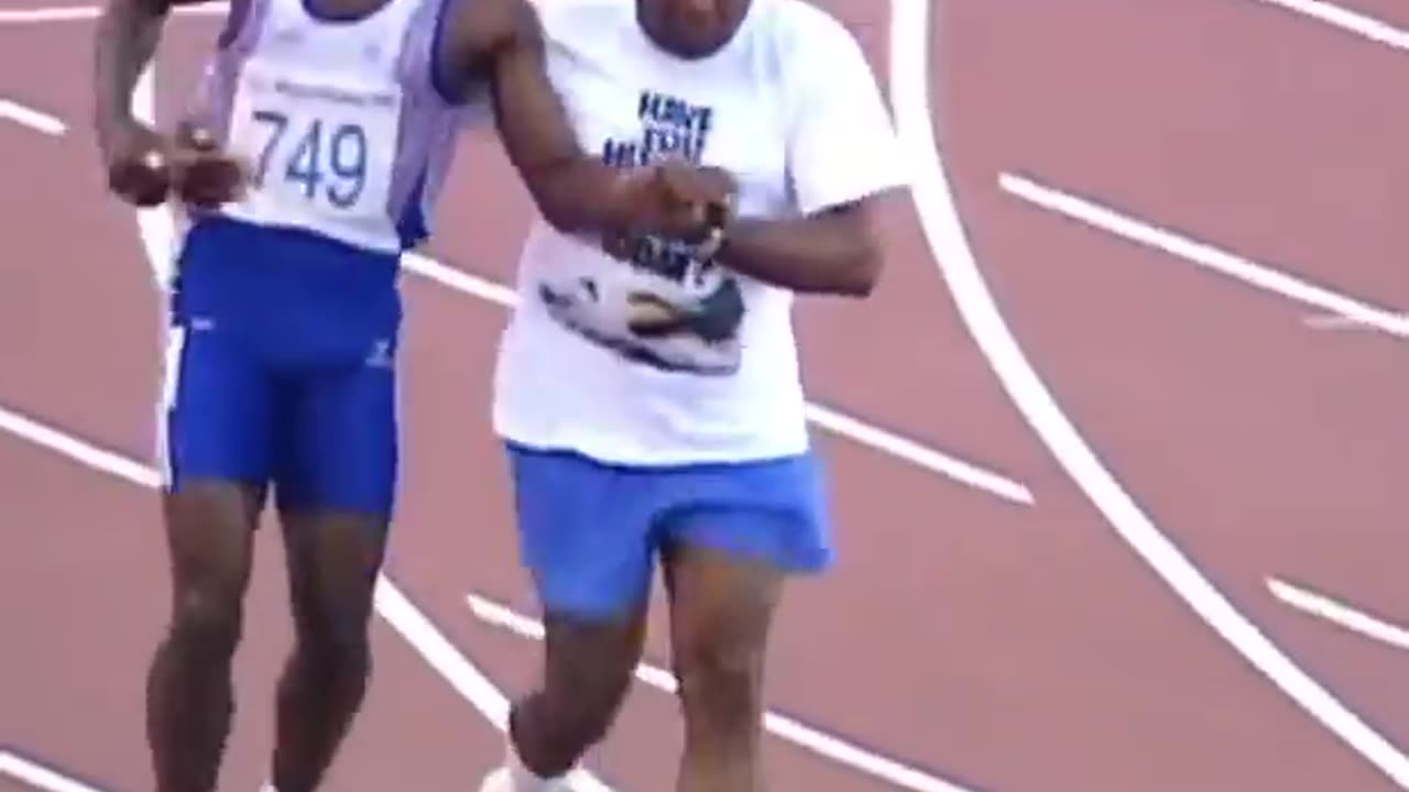 Derek Redmond’s dad helps him during the Olympics after he tore his hamstring