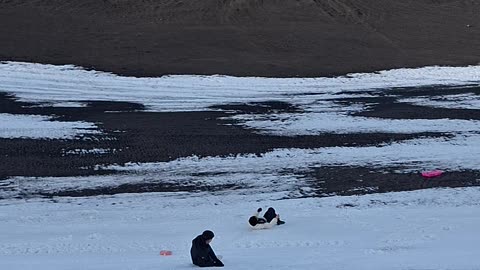 Sledding Girl Knocks Over Boyfriend
