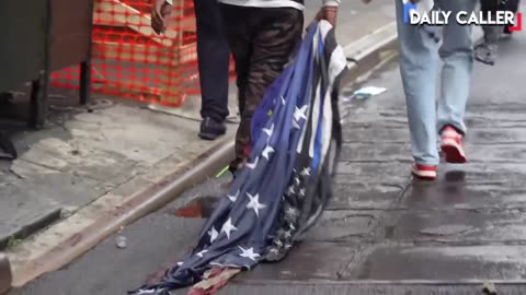 🚨 Protesters near Foley Square in NYC are dragging around an American flag: