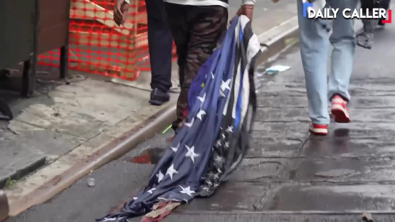 🚨 Protesters near Foley Square in NYC are dragging around an American flag: