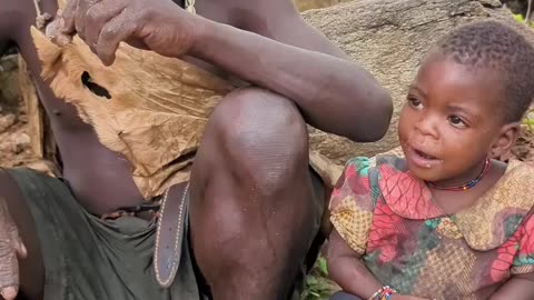 young girl eating baboon intestine like pro #africa #hadzabetribe #food #shorts #fyp #trending