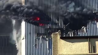 Edna Cintron waving from the gaping hole left by Flight 11’s impact on the World Trade Center September 11, 2001
