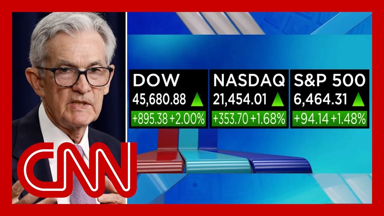 DOW soars into record territory as Powell hints at rate cut