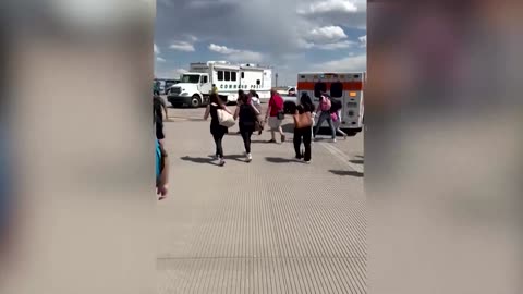 Passengers flee smoking American Airlines plane on a Denver runway