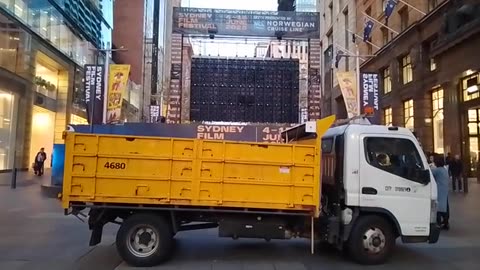 Yellow truck in front of fountain from The Matrix echoes earlier Elon Musk tweet