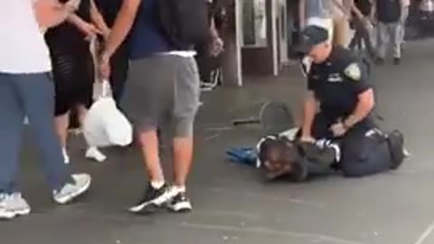 Many men film and watch without helping the woman attacked by usual suspect. Intolerable