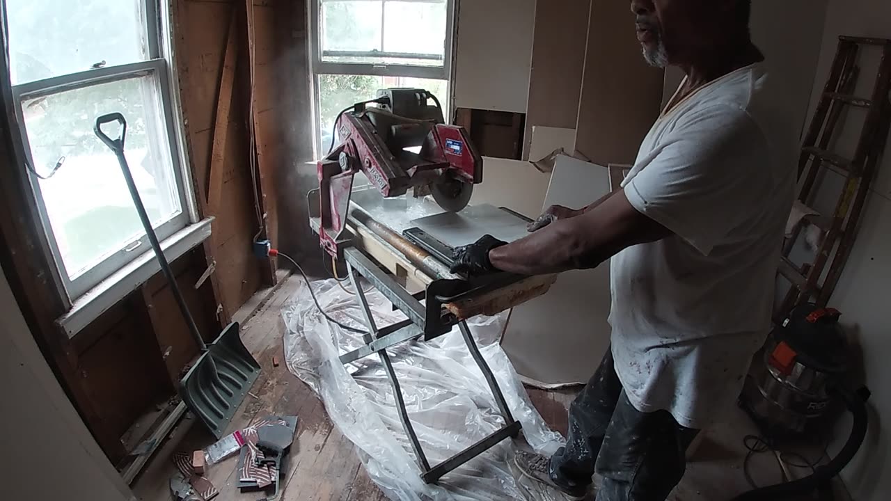 James doing tile in the Great gazoo_s bathroom,- SHEA SHOW