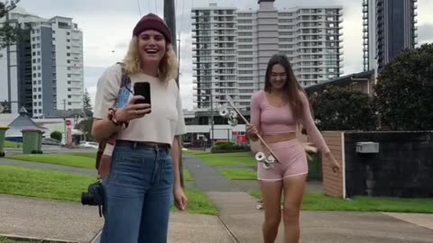 Girls Walking Barefoot Around Beach Town