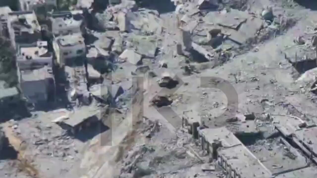 Palestinian resistance fighter emerging from rubble