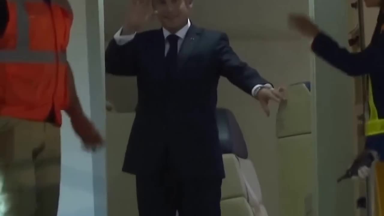 Emmanuel Macron appears to be pushed in the face by his wife Brigitte, macron's wife