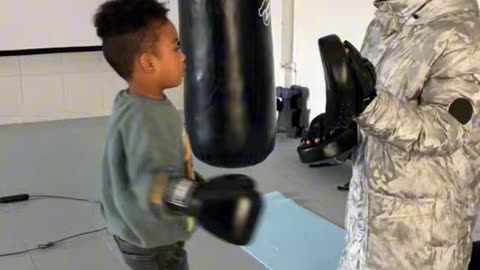 DADDY AND SON DOING BOXING