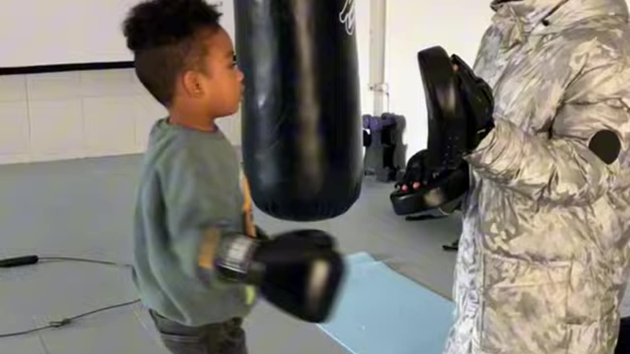DADDY AND SON DOING BOXING