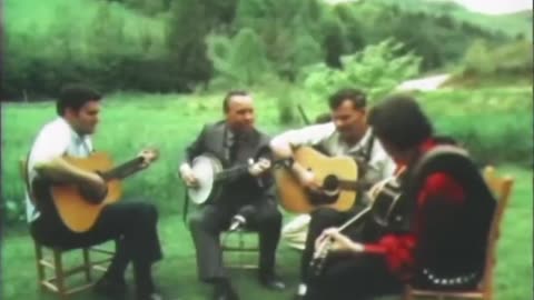 Bluegrass gods Earl Scruggs & Doc Watson (with their sons) pick the standard ‘Cripple Creek’