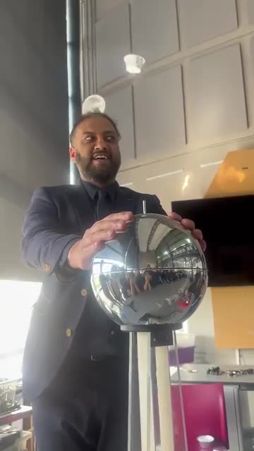 Teacher demonstrates static electricity in a different way using cups flying off his head
