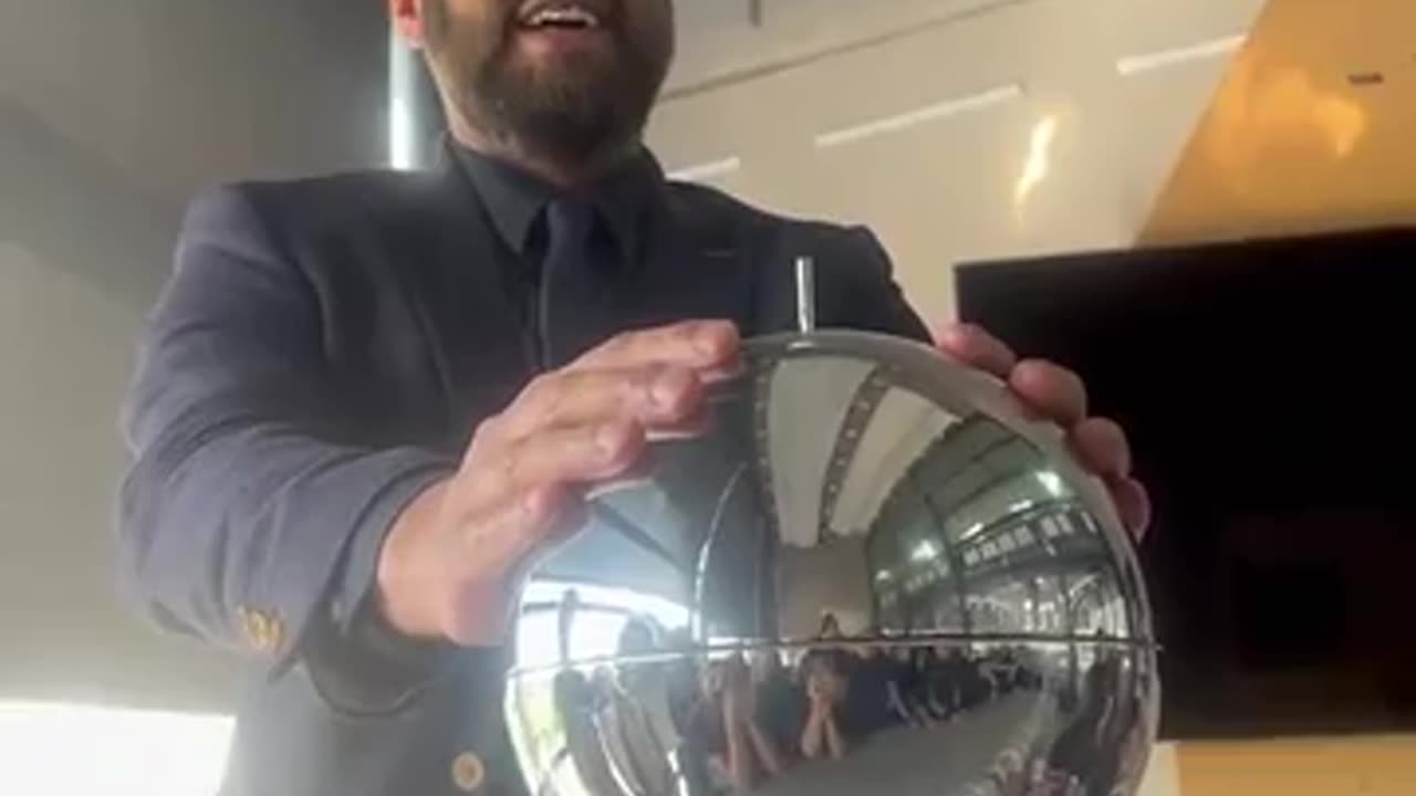 Teacher demonstrates static electricity in a different way using cups flying off his head