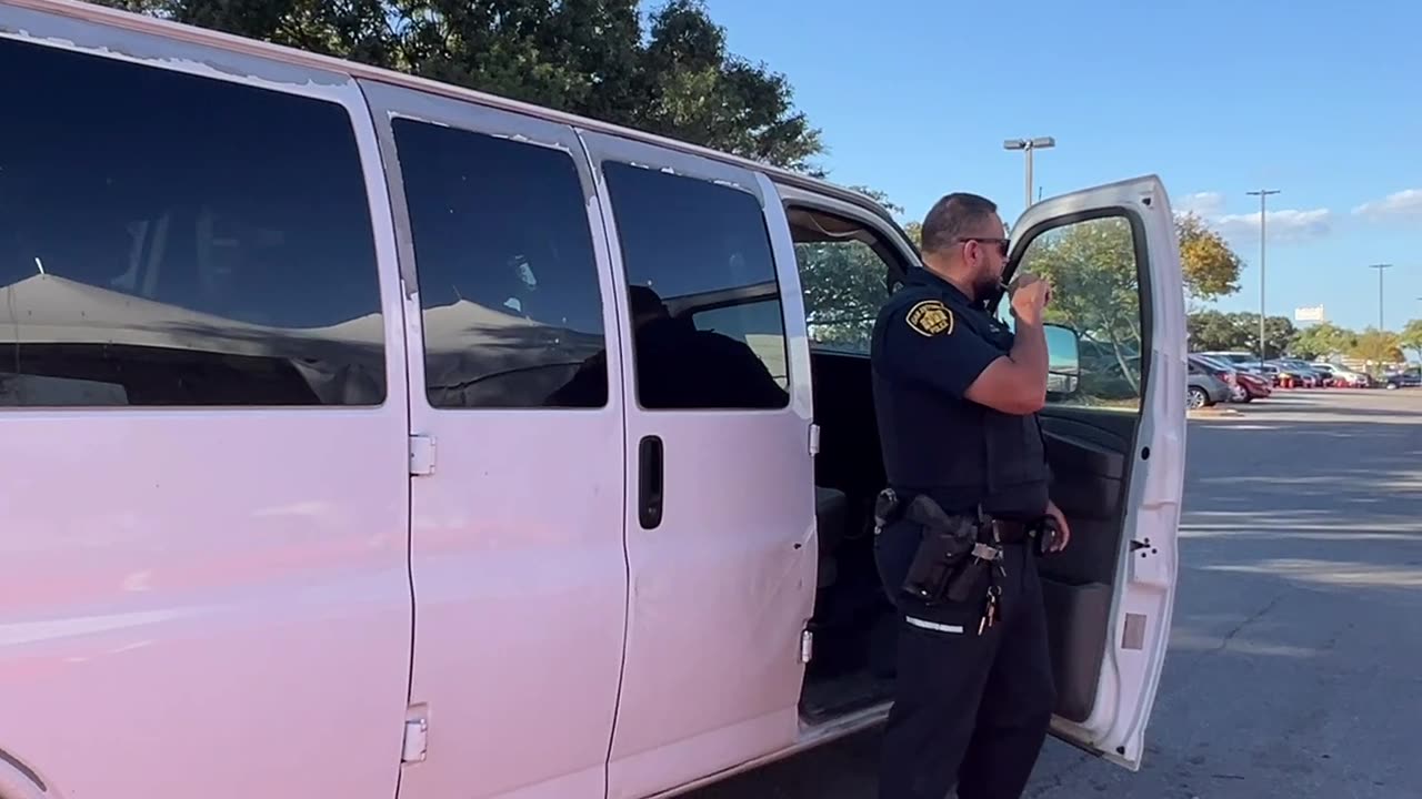 two white vans leased by Catholic Charities USA transporting illegal aliens