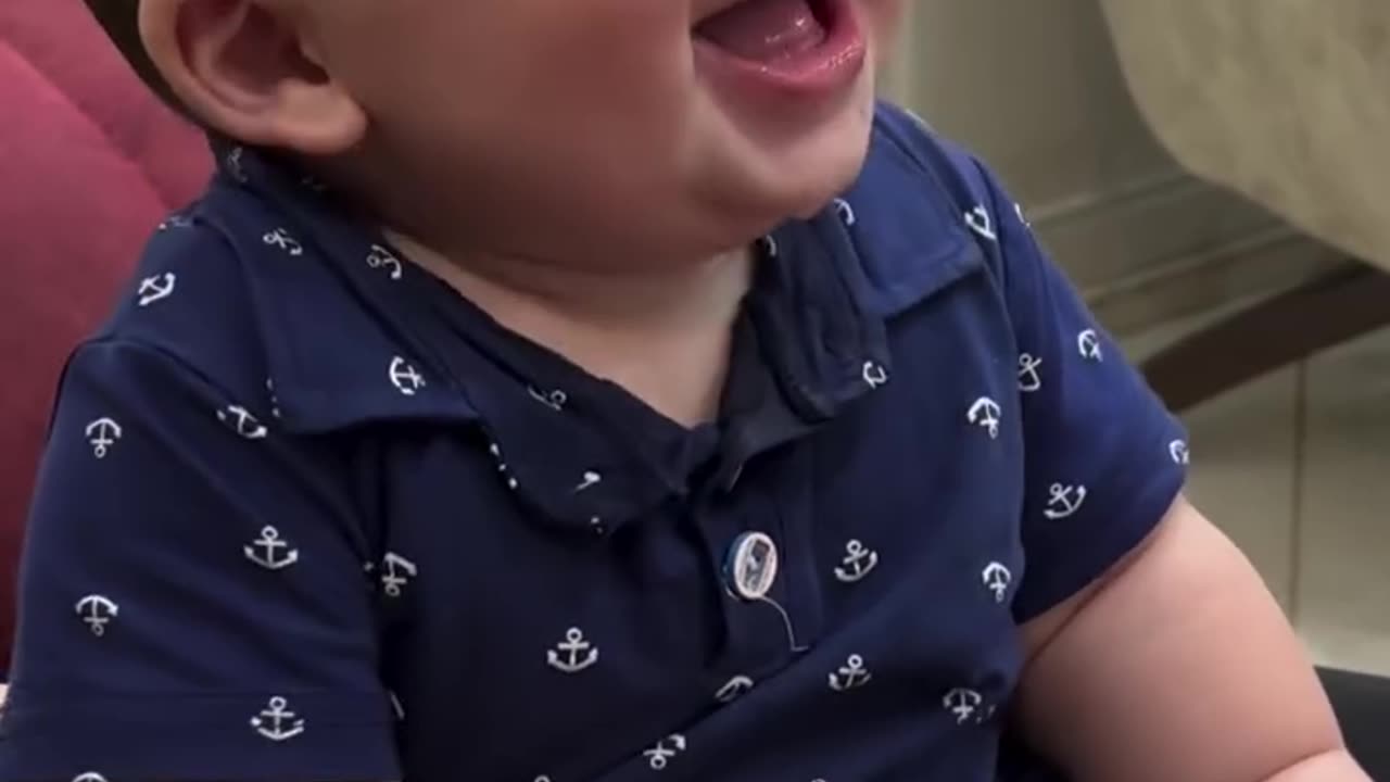 The cute baby's laughter is unstoppable