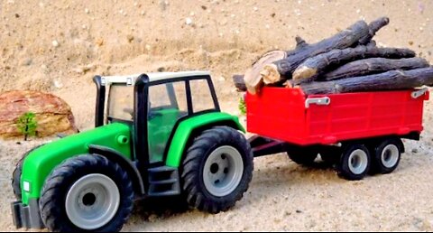 Tractor carrying construction timber play repair tractor with broken wheels